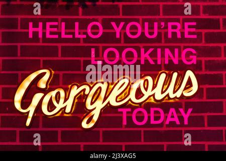 empowering slogan written on a brick wall Stock Photo
