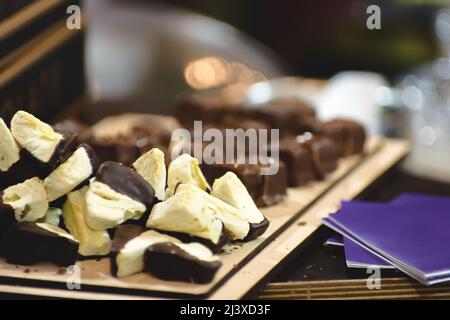 Pieces of marshmallows in chocolate.Shallow depth of field Stock Photo