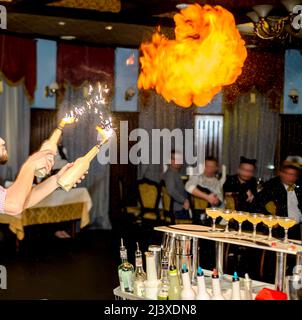 Bartender fire show in restaurant. Stock Photo
