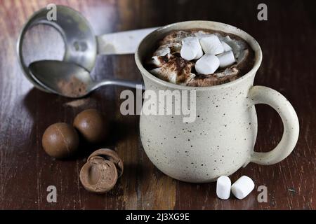 hot chocolate drink in a fictile mug on wooden background Stock Photo