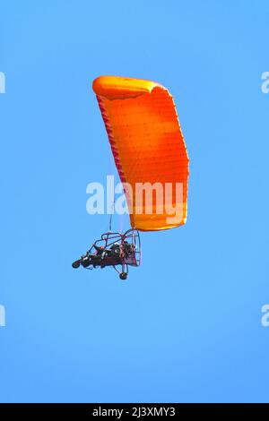 Motorized hang-glider, para-motor on a blue sky Stock Photo