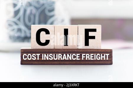 CIF words with wooden blocks on chart background. Business, Stock Photo