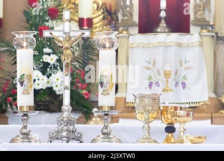 on the altar of the pyx and chalice mass they contain wine and hosts, blood and body of Christ. Stock Photo