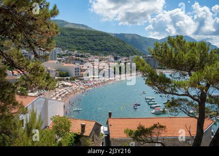 People sunbathing and swimming at Budva Beach in Montenegro Stock Photo