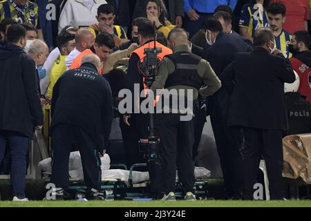 ISTANBUL - A supporter is drained during the Turkish Superliga match between Fenerbahce AS and Galatasaray AS at Ulker Fenerbahce Sukru Saracoglu Stadium on April 10, 2022 in Istanbul, Turkey. ANP | Dutch Height | Gerrit van Keulen Stock Photo