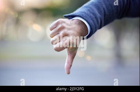 I hate that idea. Shot of a businessman giving the thumbs down. Stock Photo