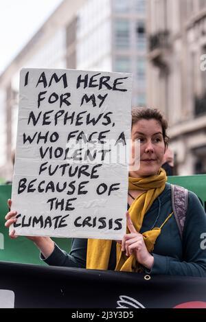 Extinction Rebellion protesters launching a period of civil disruption in London from the 9 April 2022. Female with placard. Climate crises for young Stock Photo