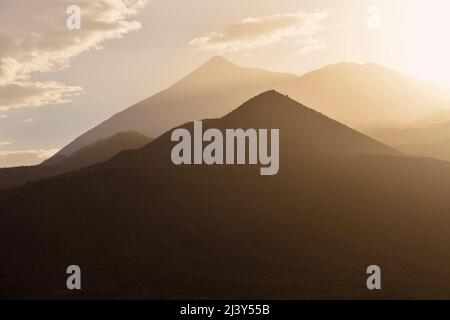 Pico del Teide and Pico Viejo highest peaks of Tenerife viewed from Teno Massif located in the northwest of Tenerife Canary islands Spain. Stock Photo