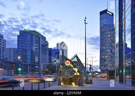 Modern Rondo ONZ metro station entrance and commercial properties at dusk in Warsaw Poland. Stock Photo