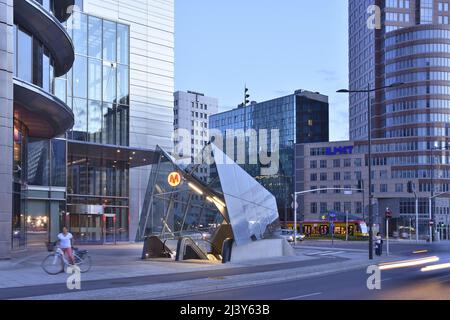 Modern Rondo ONZ metro station entrance and commercial properties at dusk in Warsaw Poland. Stock Photo