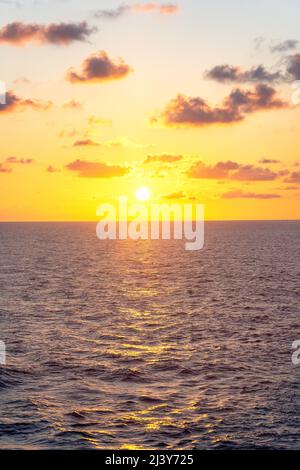 Sun setting over sea from Marella Explorer 2 cruise ship, Caribbean Sea, Caribbean Stock Photo
