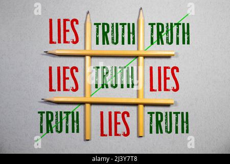 Crossing out Lies and writing Truth on a blackboard Stock Photo