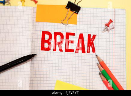 Businessman hand holding wooden cube block with break business word on table background. Mission, Vision and core values concept Stock Photo