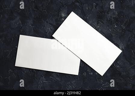Photo of blank white paper envelopes. Template for branding identity. Top view. Stock Photo