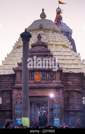 Devotees at the entrance of Main temple dome of Jagannath Temple, dedicated to Jagannath or Lord Vishnu in the coastal town of Puri, Odisha, India. Stock Photo