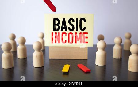 Text sign showing Basic Income. Conceptual photo periodic cash payment unconditionally delivered Minimum income Note paper taped to black computer scr Stock Photo