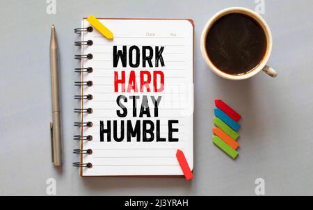 Work Hard Stay Humble Text written on notebook page, red pencil on the right. Motivational Concept image Stock Photo