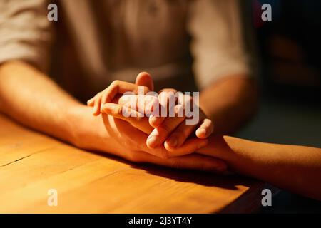 Ill always be here for you.... Cropped shot of a couple holding hands. Stock Photo
