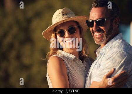 We fell in love on a day just like this. Shot of an affectionate mature couple spending some quality time together. Stock Photo