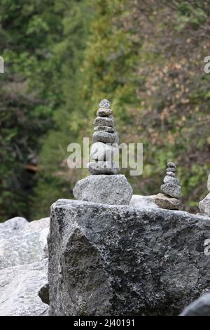 Stone cairns created by hikers in a rock garden at Mirror Lake, Yosemite National Park. Stock Photo