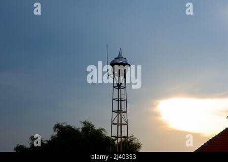 view of mosque loudspeakers and blue sky in the village in the afternoon. the sun has set Stock Photo