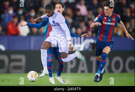 Valencia, Spain. 10th Apr, 2022. Barcelona's Ousmane Dembele (front) controls the ball during a La Liga Santander match between Levante UD and FC Barcelona in Valencia, Spain, on April 10, 2022. Credit: Str/Xinhua/Alamy Live News Stock Photo