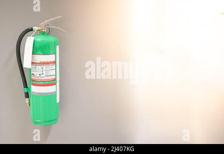 Fire extinguishers hanging on the wall are available in fire emergencies at the subway station. Stock Photo