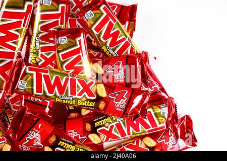 May 4, 2021. New York. Twix cookies coated with milk chocolate isolated on a white background. Stock Photo