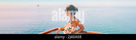 Cruise ship travel vacation woman looking at ocean from balcony of yacht deck. Luxury exotic tropical destination summer lifestyle Stock Photo