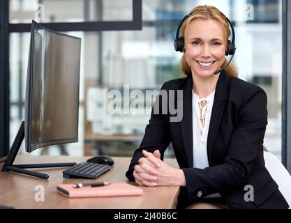 Fulfillment comes from hard work. Shot of a mature businesswoman working on a computer in an office. Stock Photo