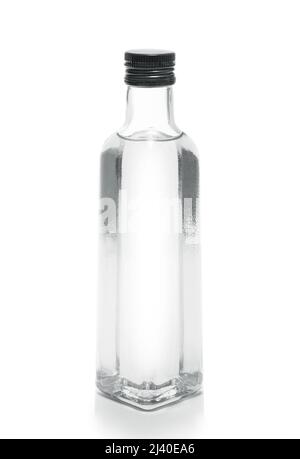 bottle of vodka or transparent drink, on white Stock Photo