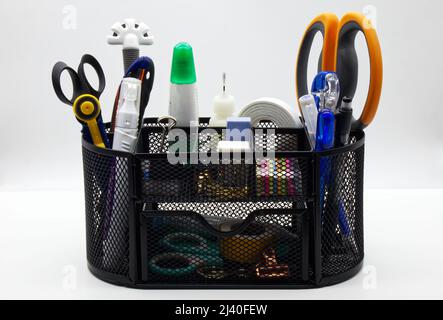 Pen holder with office stationery isolated on white background. Pen holder office equipment Stock Photo