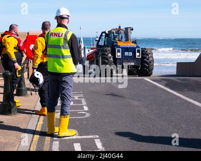 A semi rigid fast rescue craft being launched for crew training from the RNLI lifeboat station, at Redcar, North Yorkshire. Stock Photo