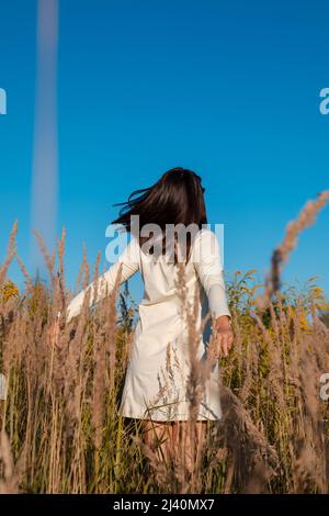 Beautiful woman posing in wheat field. Picnic Stock Photo - Alamy