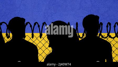 Silhouette of people against barbed wire and ukraine flag background Stock Photo