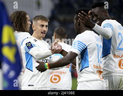 Bamba Dieng of Marseille celebrates his goal with Valentin Rongier (left), Pape Gueye during the French championship Ligue 1 football match between Olympique de Marseille (OM) and Montpellier HSC (MHSC) on April 10, 2022 at Stade Velodrome in Marseille, France - Photo: Jean Catuffe/DPPI/LiveMedia Stock Photo