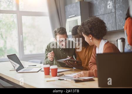 business team works in the hall of the coworking center . Stock Photo