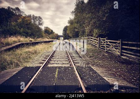 Abandoned railway station in autumn Stock Photo