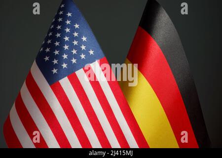 Flags of the USA and Germany as a symbol of political relations. Stock Photo