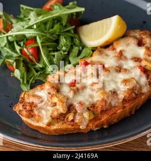 Bake Toast topped with Tuna and cheddar Cheese. The concept of healthy eating.Halal Food Stock Photo