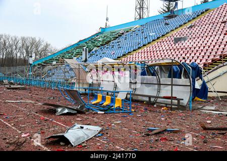 CHERNIHIV, UKRAINE - APRIL 9, 2022 - The damaged stands and tracks are pictured at the Chernihiv Olympic Sports Training Centre (formerly Yuri Gagarin Stock Photo
