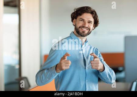 Portrait of smiling business man posing looking at camera Stock Photo