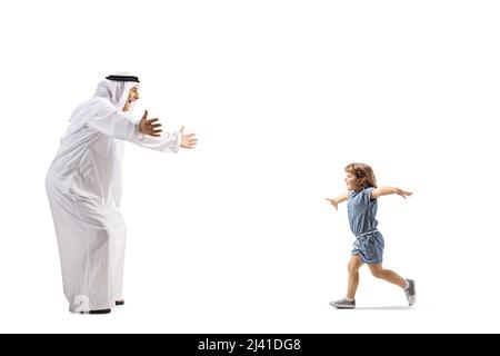 Full length profile shot of a little girl running towards an arab man in ethnic clothes isolated on white background Stock Photo