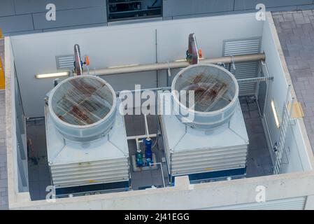 Air conditioning HVAC cooling towers on the roof of a commercial building in Australia Stock Photo