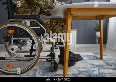 Unrecognizable military man with disability in wheelchair Stock Photo