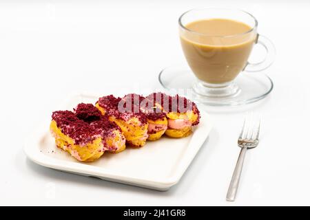 Eclair cake with raspberry isolated on white background. Close-up. Stock Photo