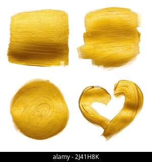 Gold metallic foil paint hand brush strokes set smudge design element isolated on white background. Stock Photo