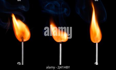 Burning match stick with bright big fire and smoke set isolated on black Stock Photo