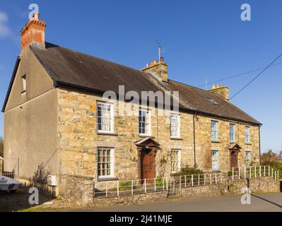 Example of a traditional Welsh semi detached cottages made of Welsh stone. Newport, Pembrokeshire, Wales. UK. Stock Photo