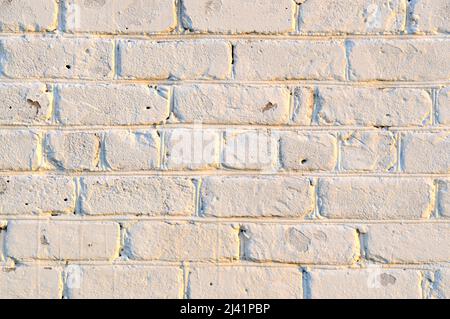 Old white brick wall. Ancient stone texture background. Urban background, white ruined industrial brick wall with copy space. Home and office design Stock Photo